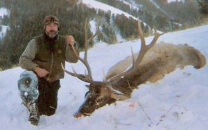 Man with Caribou - Montana and Yellowstone Hunting Outfitters