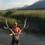Boy Holding Caribou Skull - Montana hunting guides